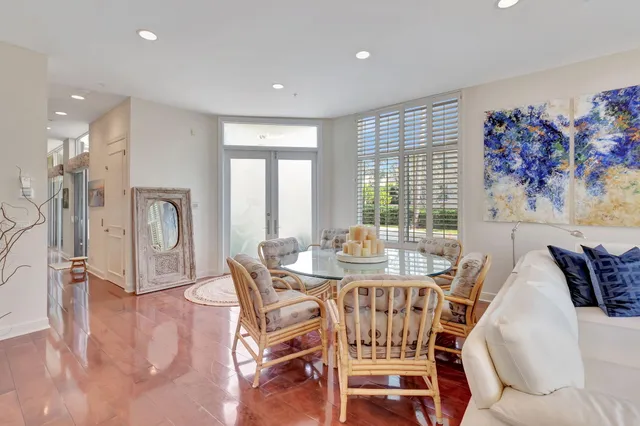 a dining room with furniture and wooden floor