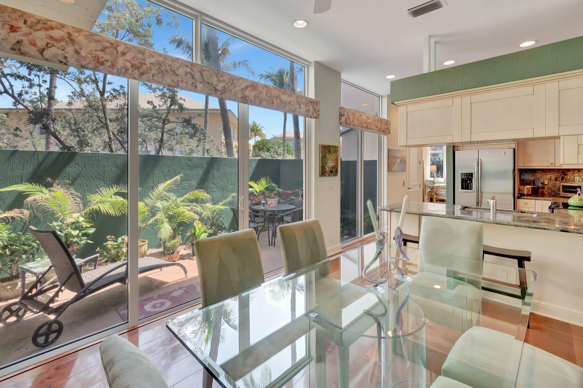 2115 South Ocean Boulevard, Unit 14 Delray Beach, FL 33483 - Photo 23 of 56 a living room with furniture and a floor to ceiling window