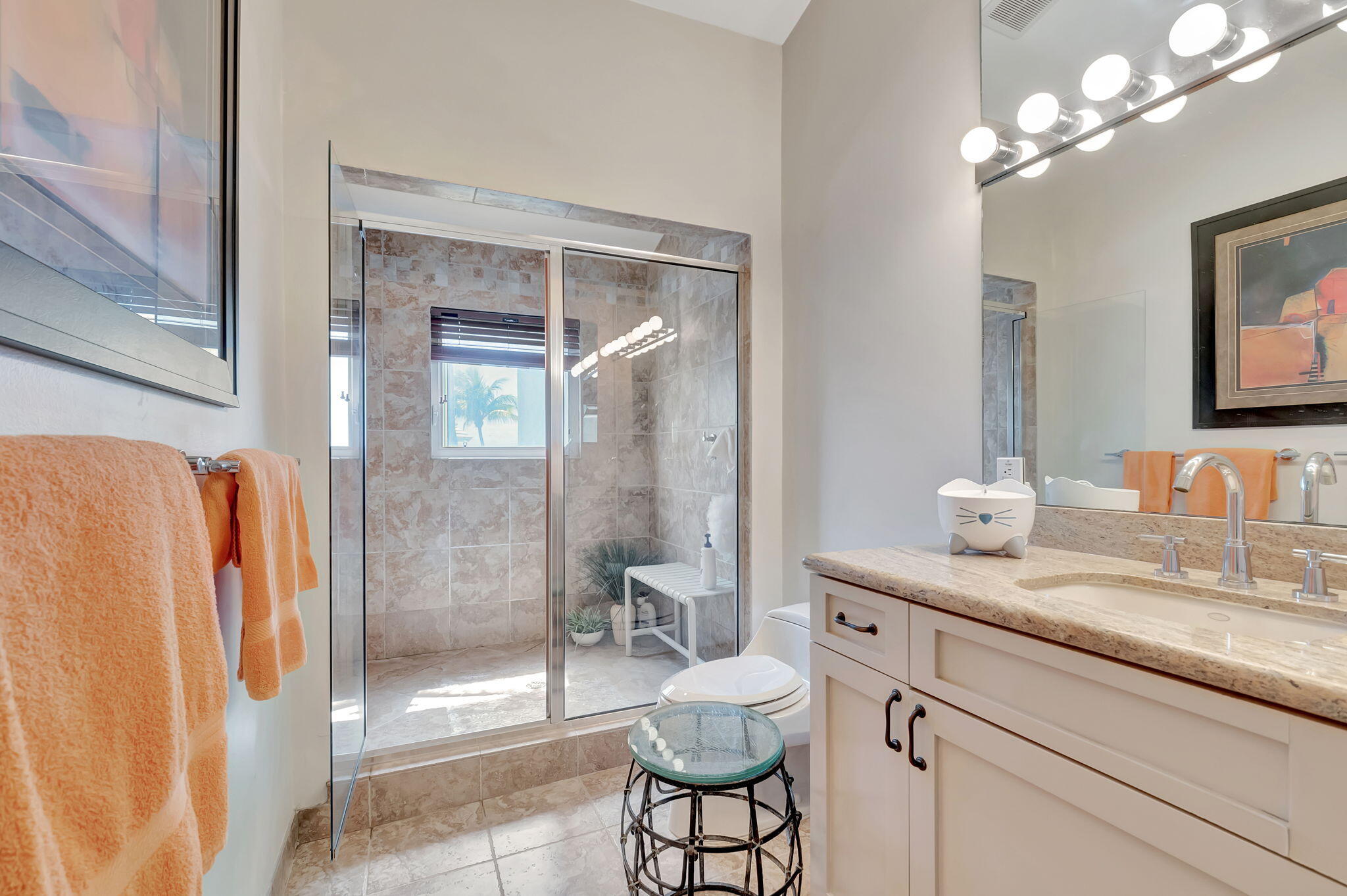 2115 South Ocean Boulevard, Unit 14 Delray Beach, FL 33483 - Photo 34 of 56 a bathroom with a granite countertop sink a toilet and shower