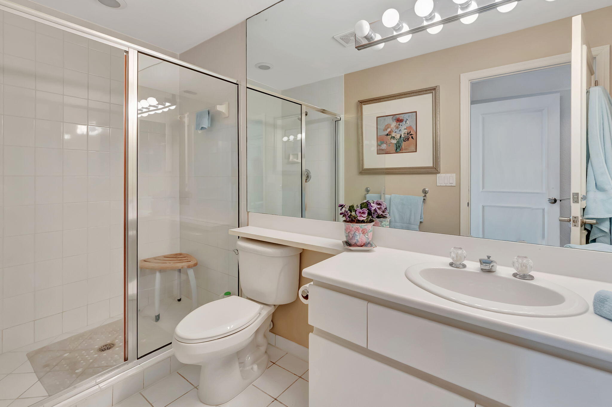 2115 South Ocean Boulevard, Unit 14 Delray Beach, FL 33483 - Photo 39 of 56 a bathroom with a sink toilet and shower