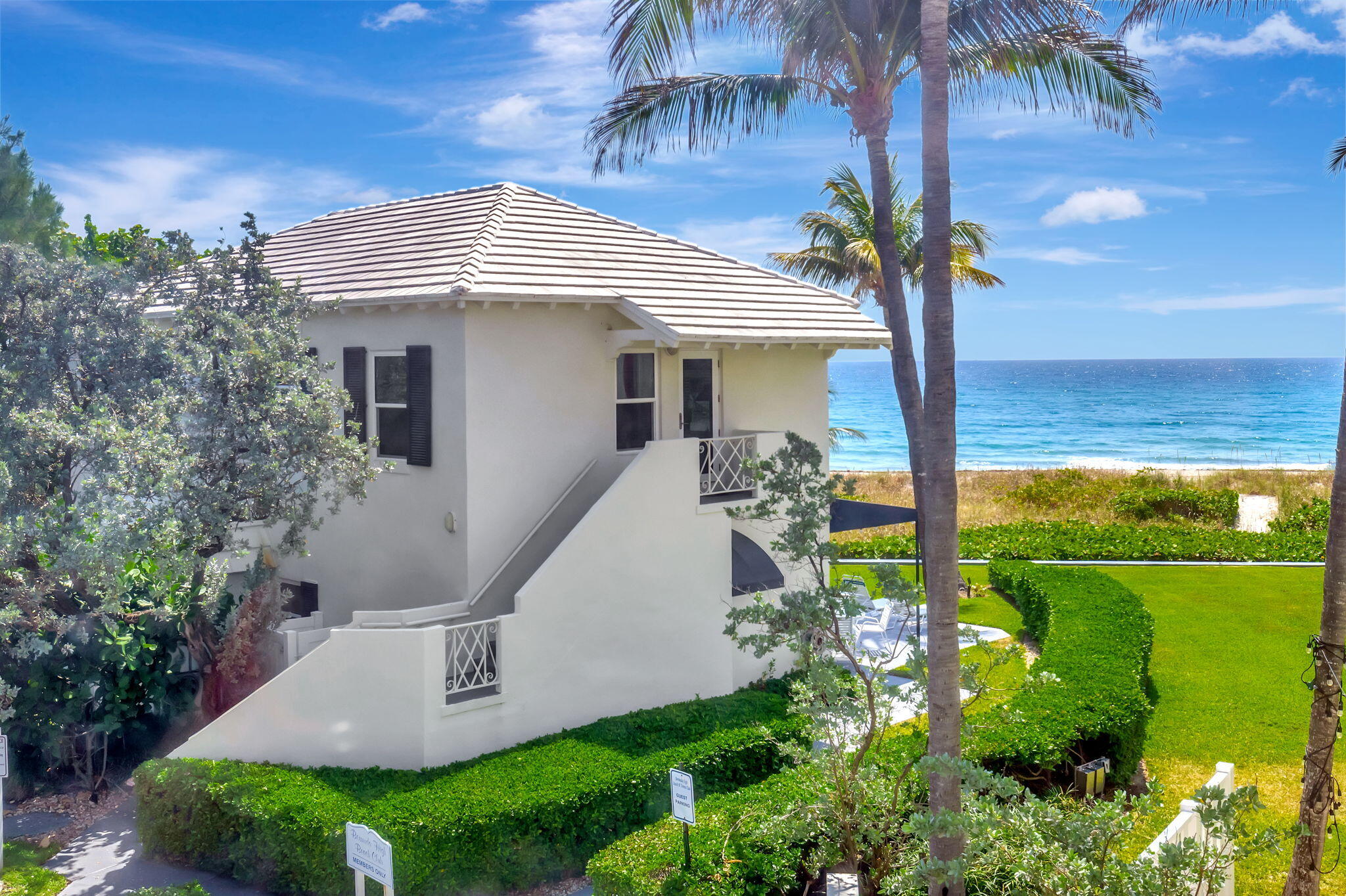 2115 South Ocean Boulevard, Unit 14 Delray Beach, FL 33483 - Photo 41 of 56 a front view of a house with garden