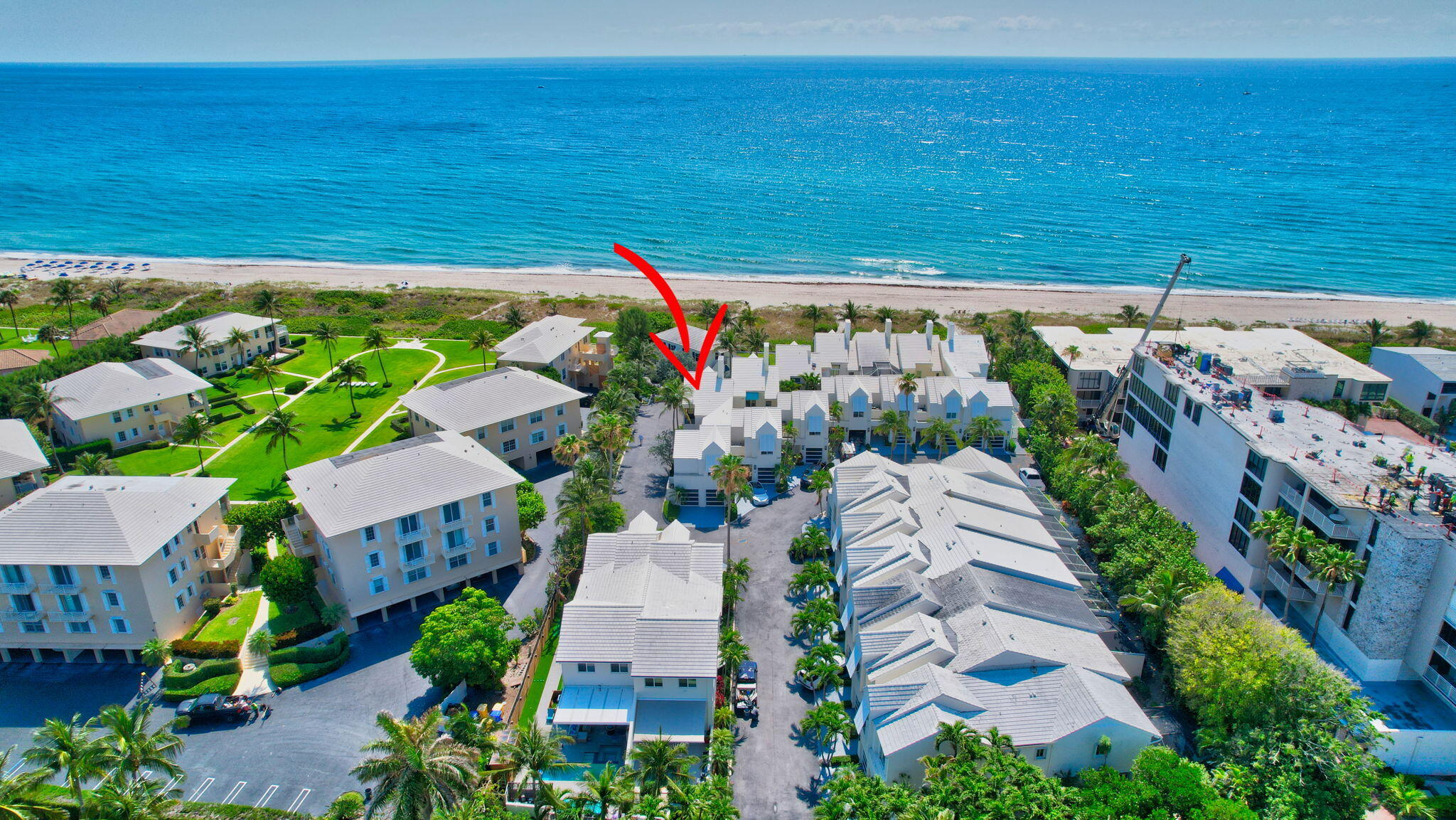 2115 South Ocean Boulevard, Unit 14 Delray Beach, FL 33483 - Photo 48 of 56 a view of a swimming pool with an outdoor space and seating area