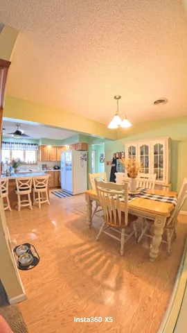 a view of a swimming pool with outdoor seating