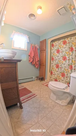 a bedroom with a bed and cabinets