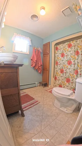 a bedroom with a bed and cabinets