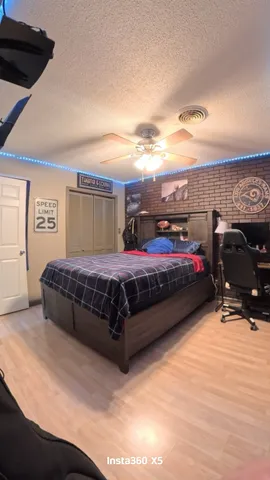 a bedroom with a bed and dresser