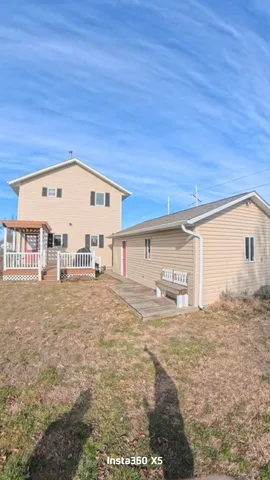 a view of a back yard of the house