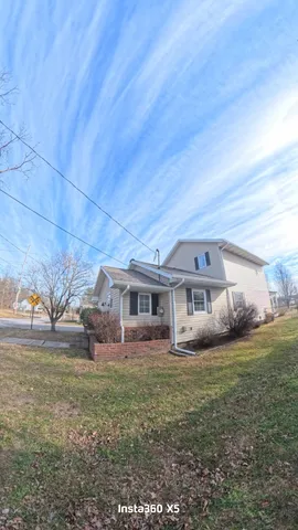 front view of a house with a big yard
