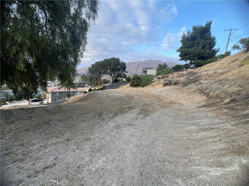 20254 West Point Drive Riverside, CA 92507 - Photo 6 of 7 a view of a dirt road with a building in the background
