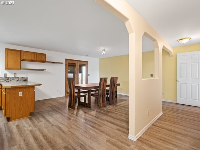 2488 Pheasant Ridge Street Umatilla, OR 97882 - Photo 14 of 40 a view of a dining room with furniture and wooden floor