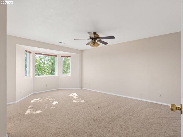 2488 Pheasant Ridge Street Umatilla, OR 97882 - Photo 17 of 40 an empty room with a window and a fan