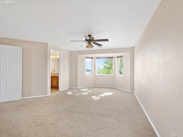 2488 Pheasant Ridge Street Umatilla, OR 97882 - Photo 18 of 40 a view of a livingroom with a ceiling fan and window