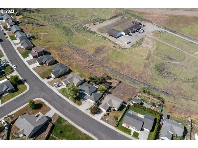 2488 Pheasant Ridge Street Umatilla, OR 97882 - Photo 40 of 40 an aerial view of residential houses with outdoor space