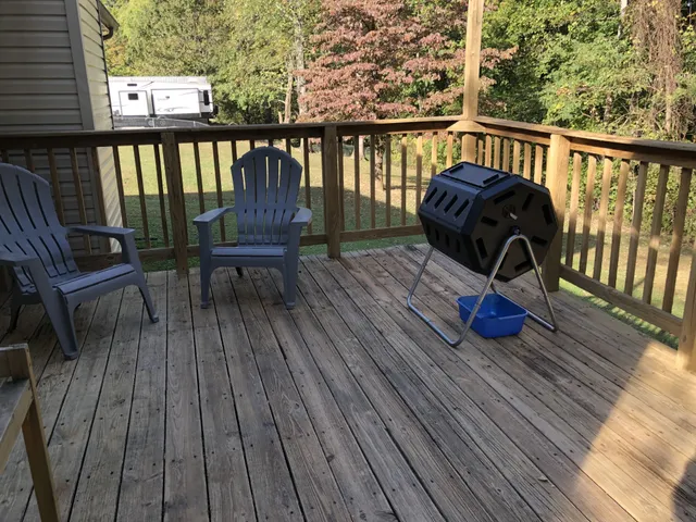 a view of a deck with wooden floor and outdoor seating