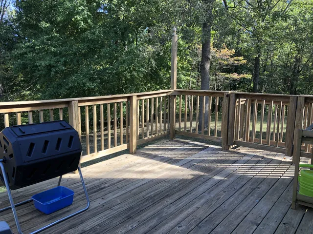 a view of a wooden deck with a bench