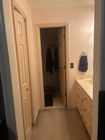 a view of a bathroom from a hallway