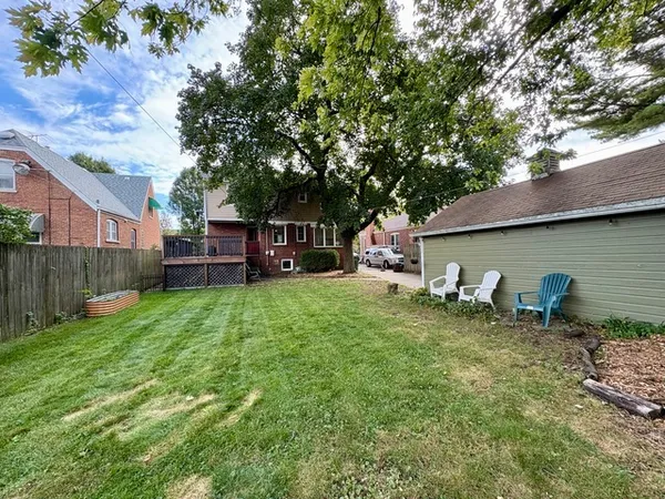 a backyard of a house with seating space