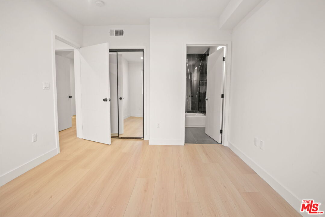 1707 South Burnside Avenue, Unit 1/2 Los Angeles, CA 90019 - Photo 15 of 30 a view of a room with an empty space