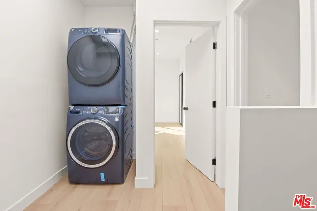 a utility room with sink dryer and washer