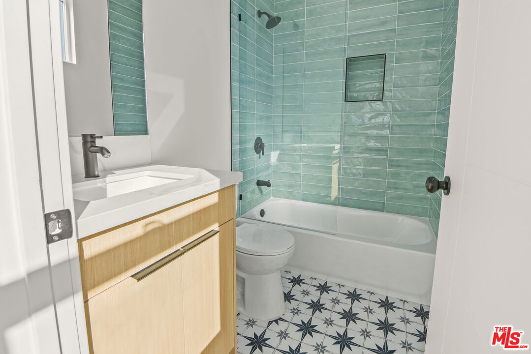 1707 South Burnside Avenue, Unit 1/2 Los Angeles, CA 90019 - Photo 22 of 30 a bathroom with a sink toilet and shower