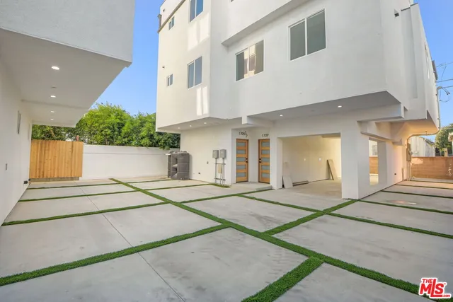a view of a building with car parked