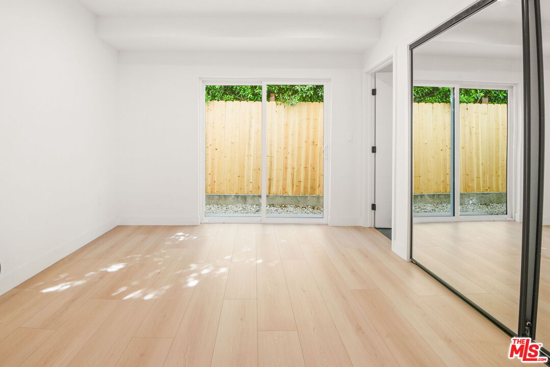 1707 South Burnside Avenue, Unit 1/2 Los Angeles, CA 90019 - Photo 8 of 30 a view of an empty room and window