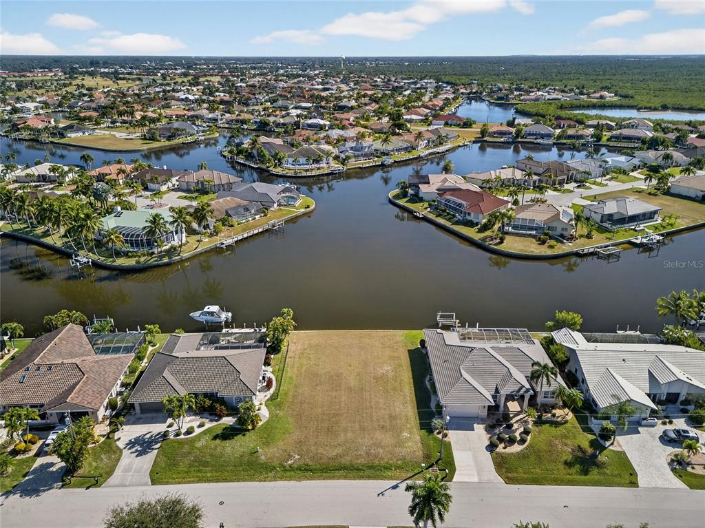 an aerial view of a house with a lake view