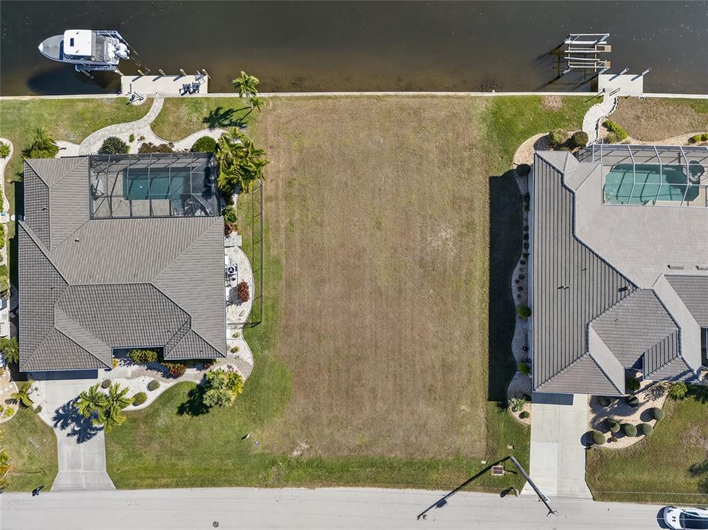 3938 San Pietro Court Punta Gorda, FL 33950 - Photo 4 of 8 an aerial view of a house with swimming pool