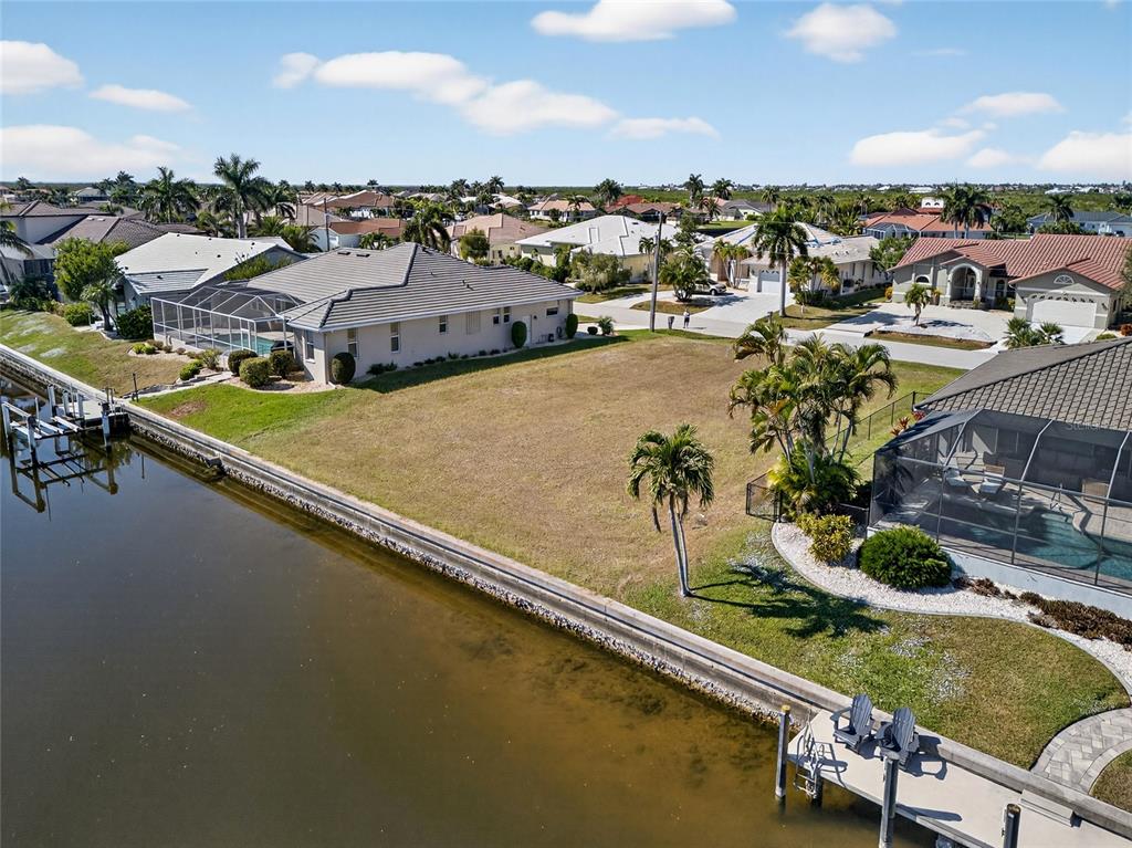 3938 San Pietro Court Punta Gorda, FL 33950 - Photo 6 of 8 an aerial view of residential houses with outdoor space