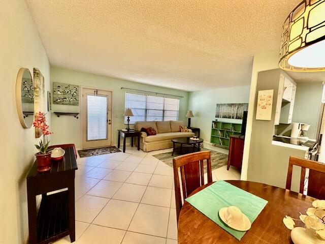 2070 Cornwall East Boca Raton, FL 33434 - Photo 9 of 30 a living room with furniture a rug and a table