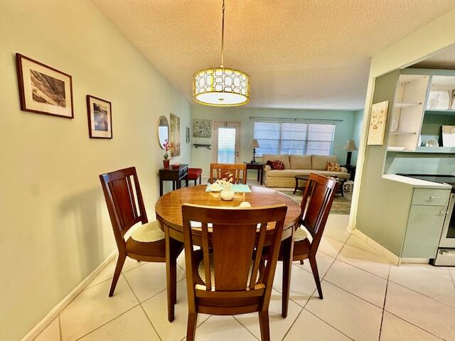 2070 Cornwall East Boca Raton, FL 33434 - Photo 10 of 30 a view of a dining room with furniture and chandelier