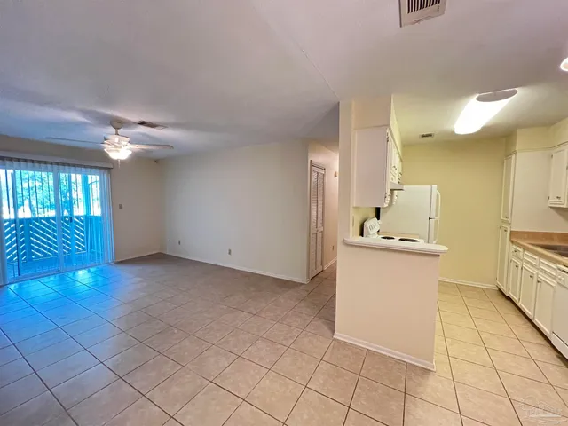 a room view with a sink and chandelier