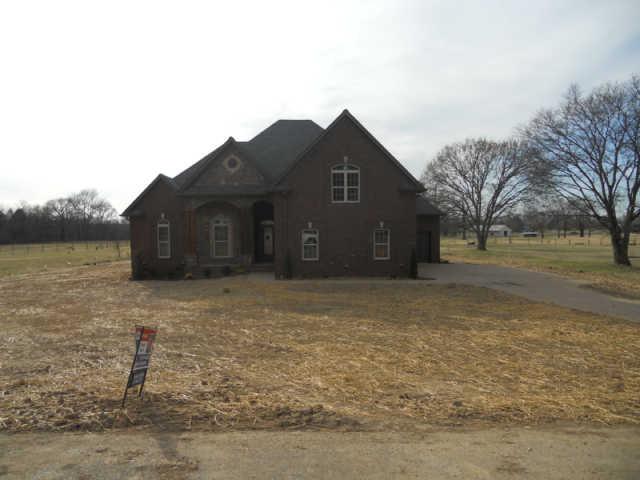 644 Bradshaw Road Lebanon, TN 37087 - Photo 2 of 3 a front view of a house with a yard and garage