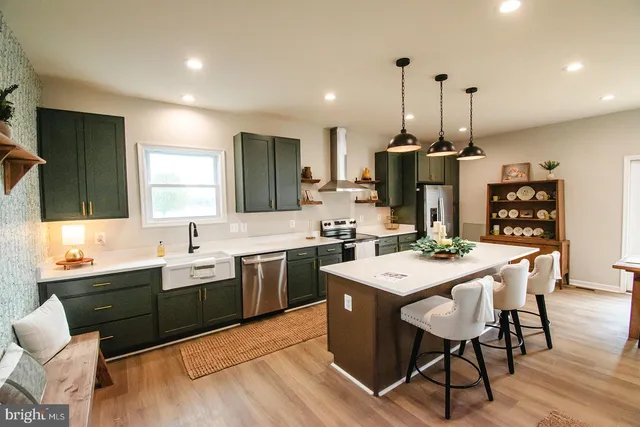 a large kitchen with a table and chairs