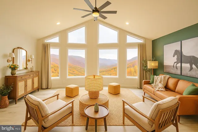 a living room with furniture and a large window