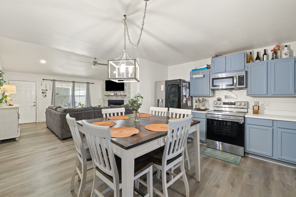 115 Rangeland Road Bastrop, TX 78602 - Photo 15 of 40 a large kitchen with a table and chairs