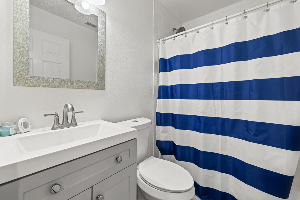 115 Rangeland Road Bastrop, TX 78602 - Photo 30 of 40 a bathroom with a sink and a mirror