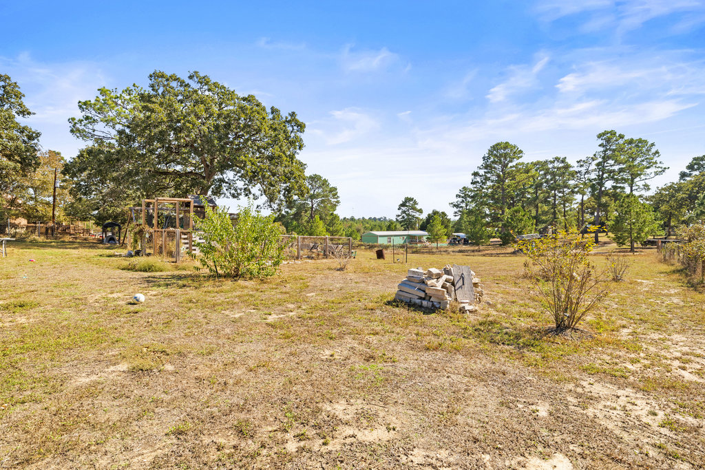 115 Rangeland Road Bastrop, TX 78602 - Photo 32 of 40 a big yard with lake view and mountain view