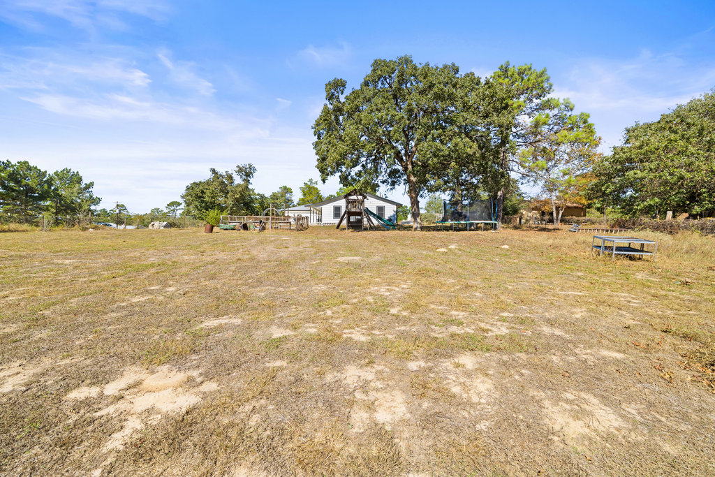 115 Rangeland Road Bastrop, TX 78602 - Photo 33 of 40 a view of ocean with trees in the background