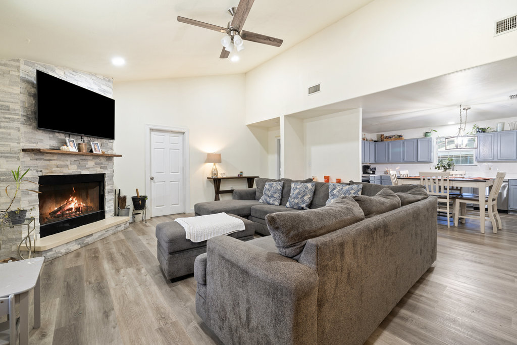 115 Rangeland Road Bastrop, TX 78602 - Photo 9 of 40 a living room with furniture fireplace and flat screen tv