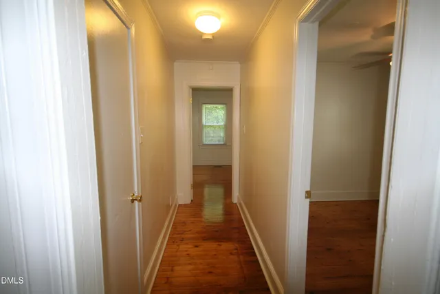 a kitchen that has a sink and a refrigerator