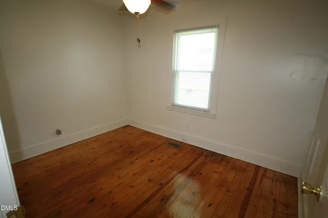 a view of a bathroom from a hallway