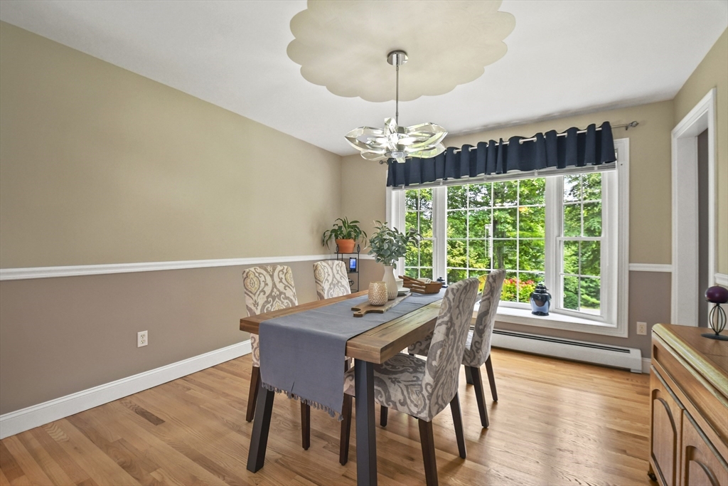 49 Miner Road Auburn, NH 03032 - Photo 5 of 42 a view of a dining room with furniture window and outside view