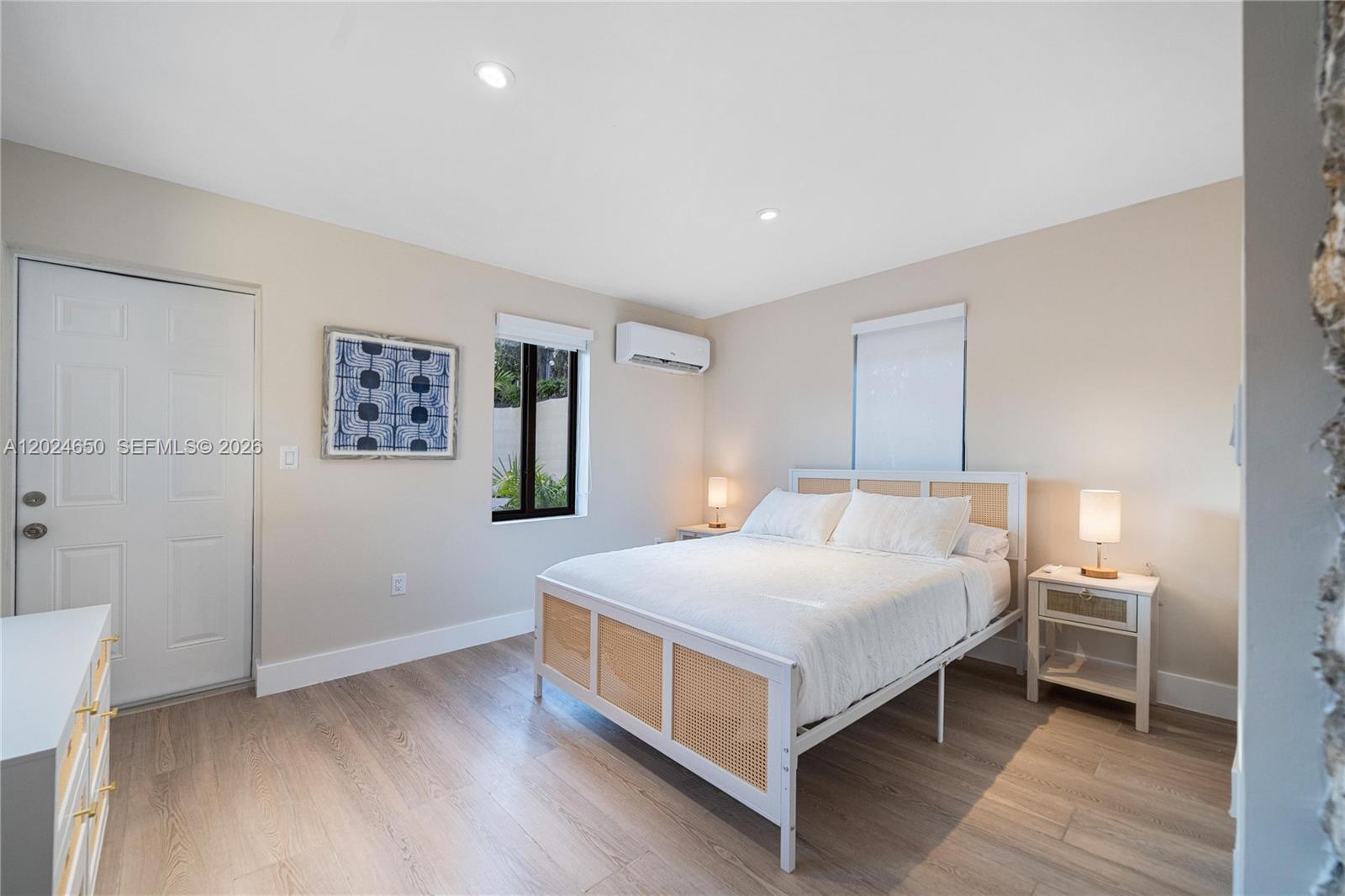 1663 Southwest 13th Street Miami, FL 33145 - Photo 4 of 112 a bedroom with a bed and a table