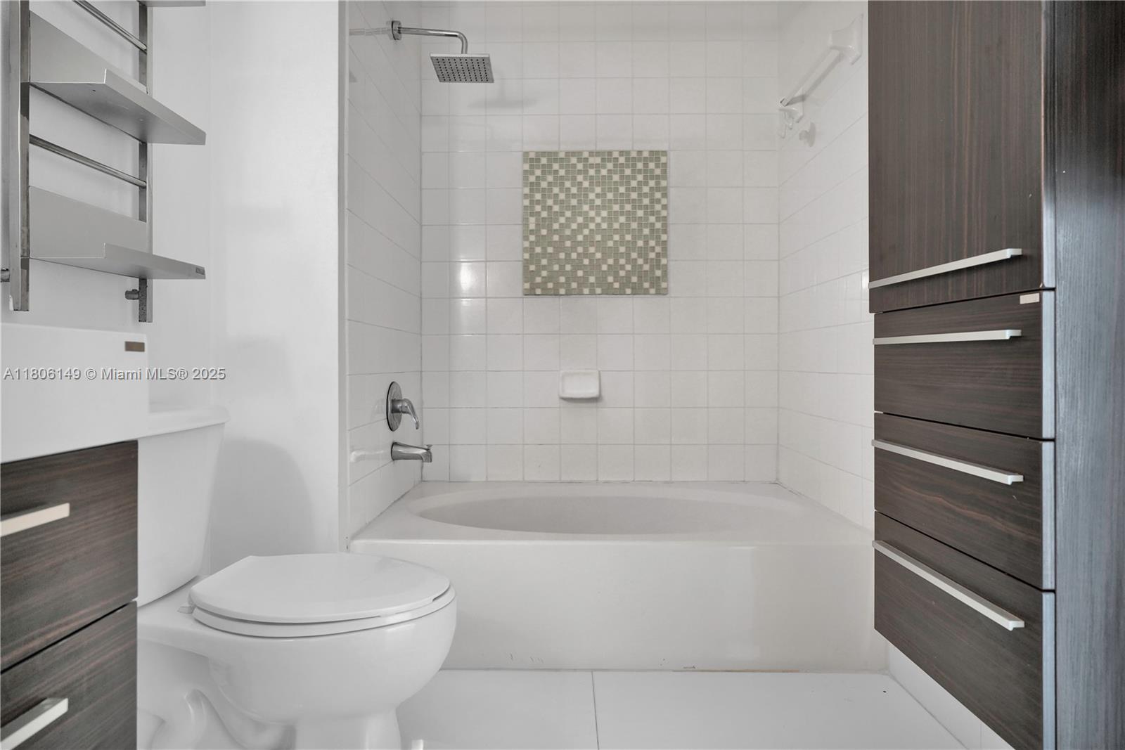 2001 Biscayne Boulevard, Unit 3213 Miami, FL 33137 - Photo 13 of 31 a bathroom with a toilet and a bathtub