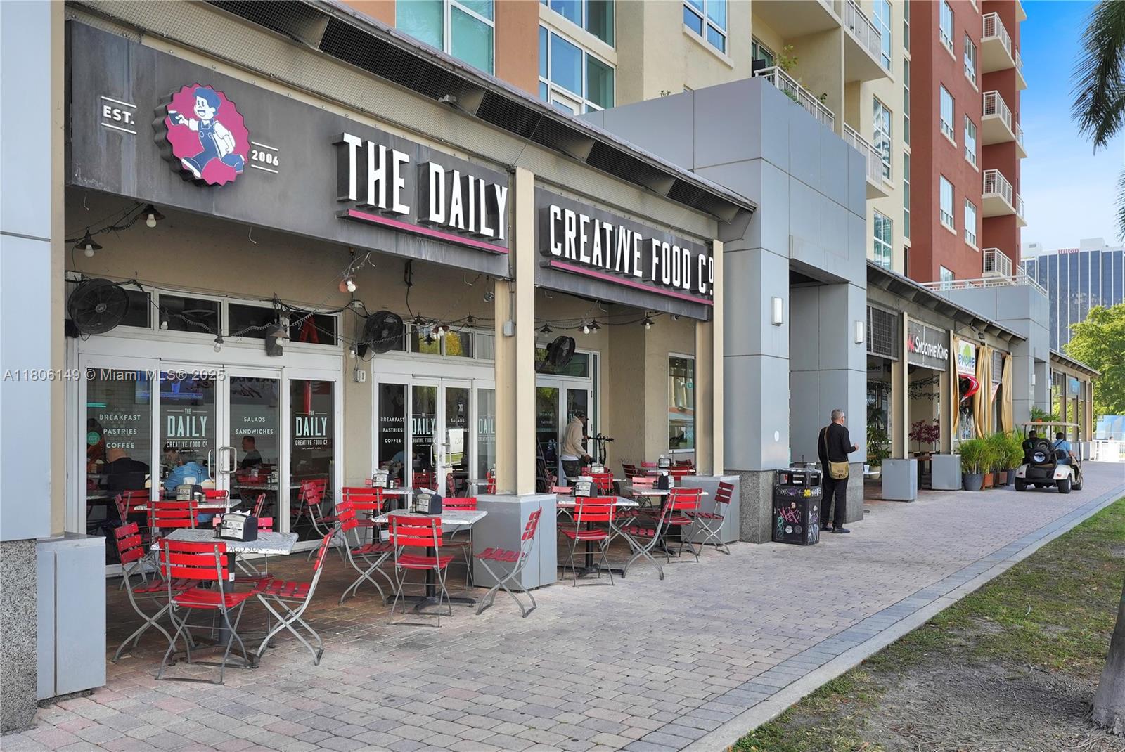 2001 Biscayne Boulevard, Unit 3213 Miami, FL 33137 - Photo 22 of 31 a view of a brick building with a bench in front of building