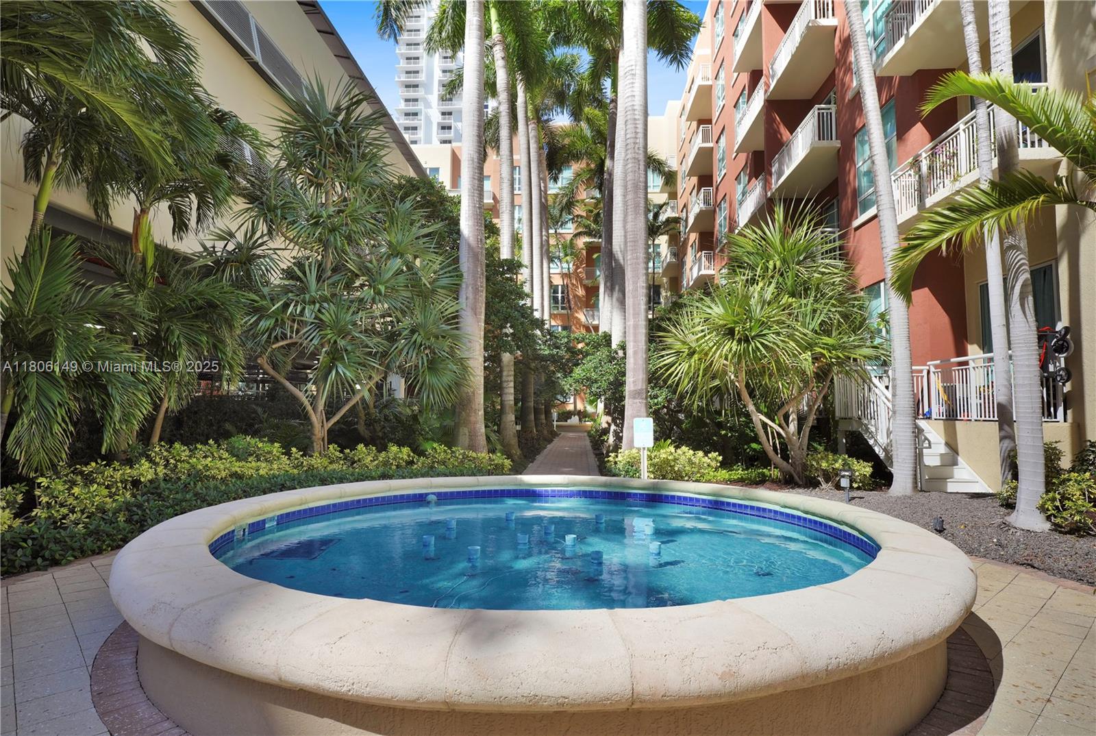 2001 Biscayne Boulevard, Unit 3213 Miami, FL 33137 - Photo 24 of 31 a view of a fountain with a house in the background