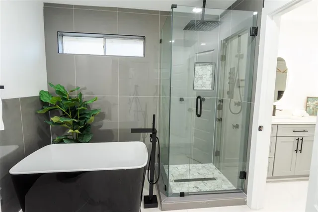 a bathroom with a sink and shower