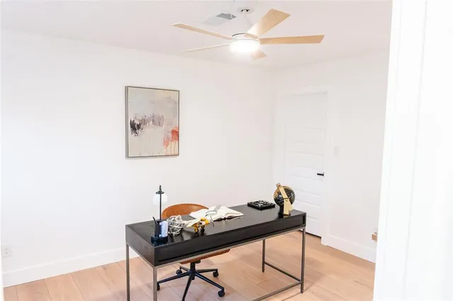 a room with furniture and a fan