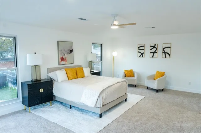 a bedroom with a bed and dresser